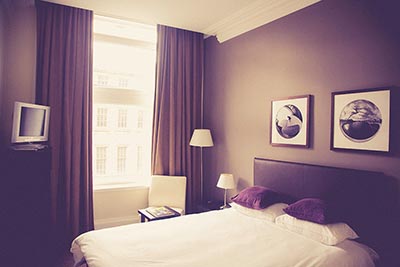 cozy hotel room with queen size bed