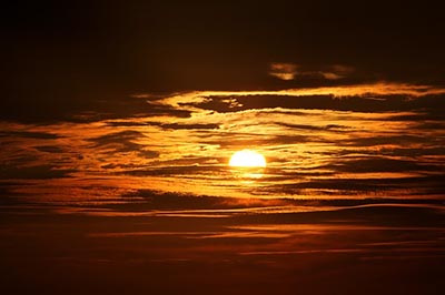 beautiful cloudy sky at sunset with orange and yellow colors