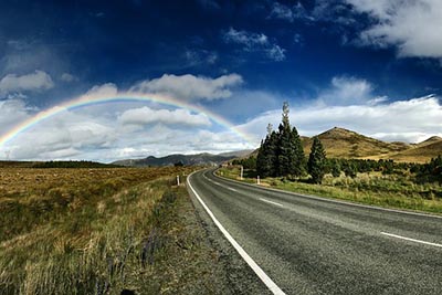 rainbow over road