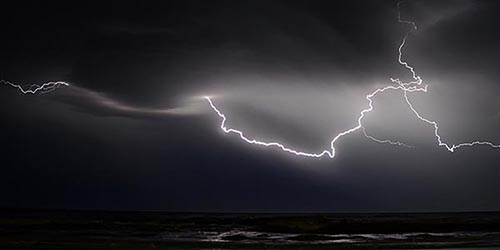 lightning in darkened sky